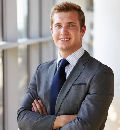 portrait-of-a-young-smiling-professional-man-arms-P9P4F5Q.jpg